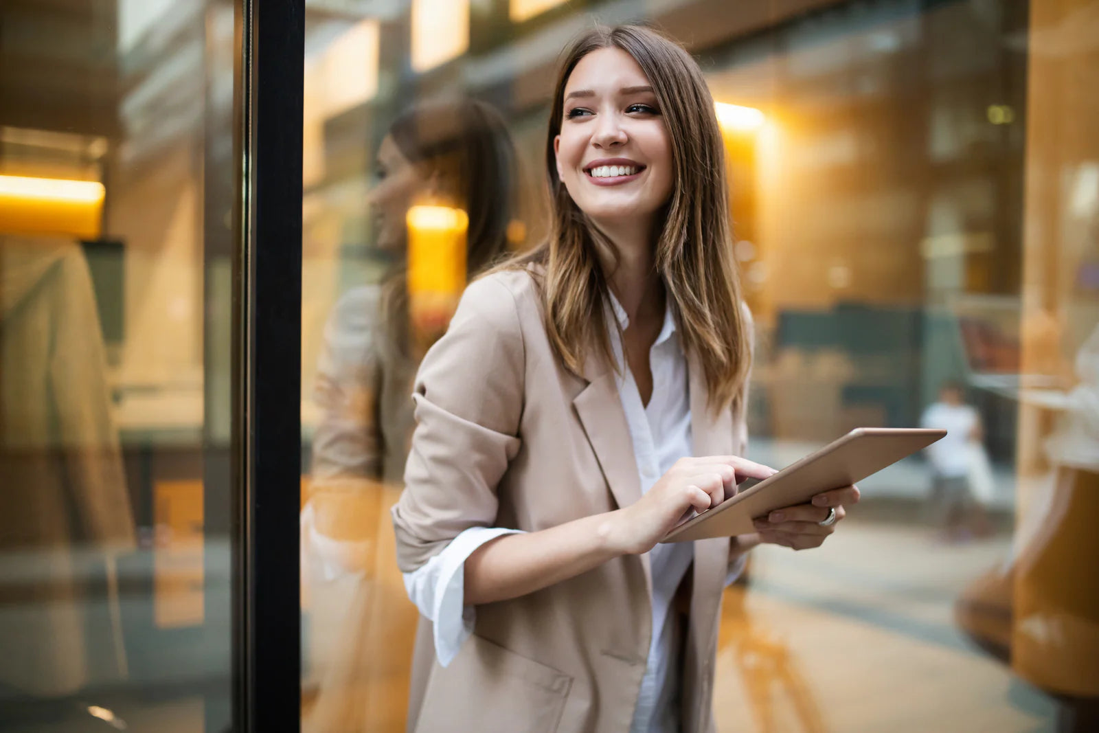 woman smiling with tablet