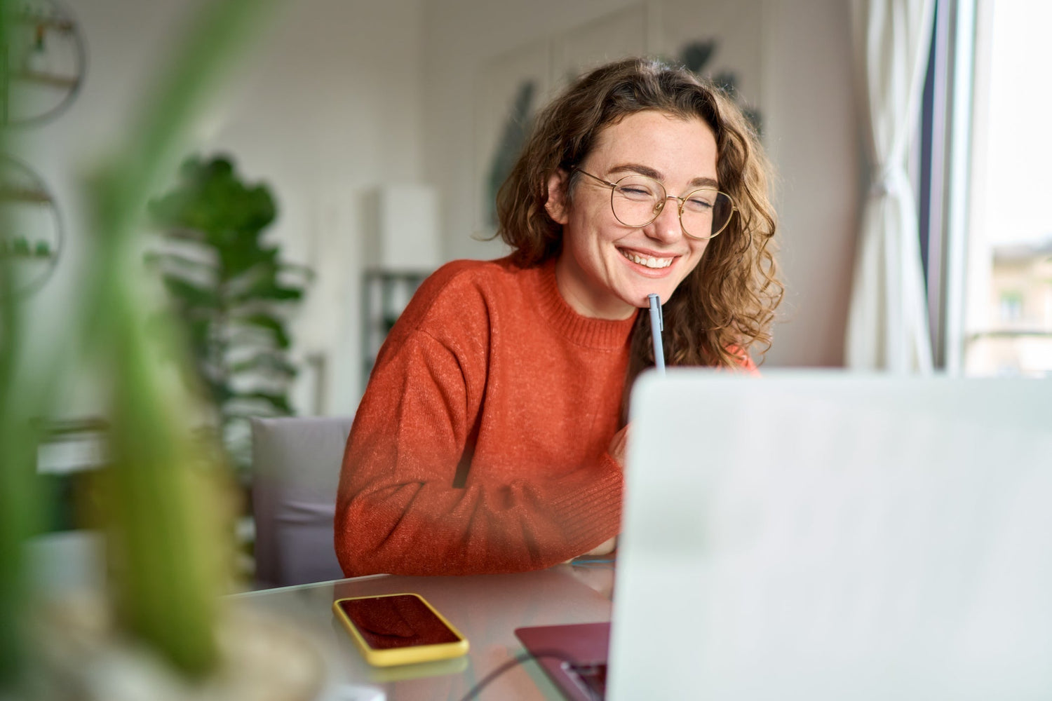 woman with glasses smiling